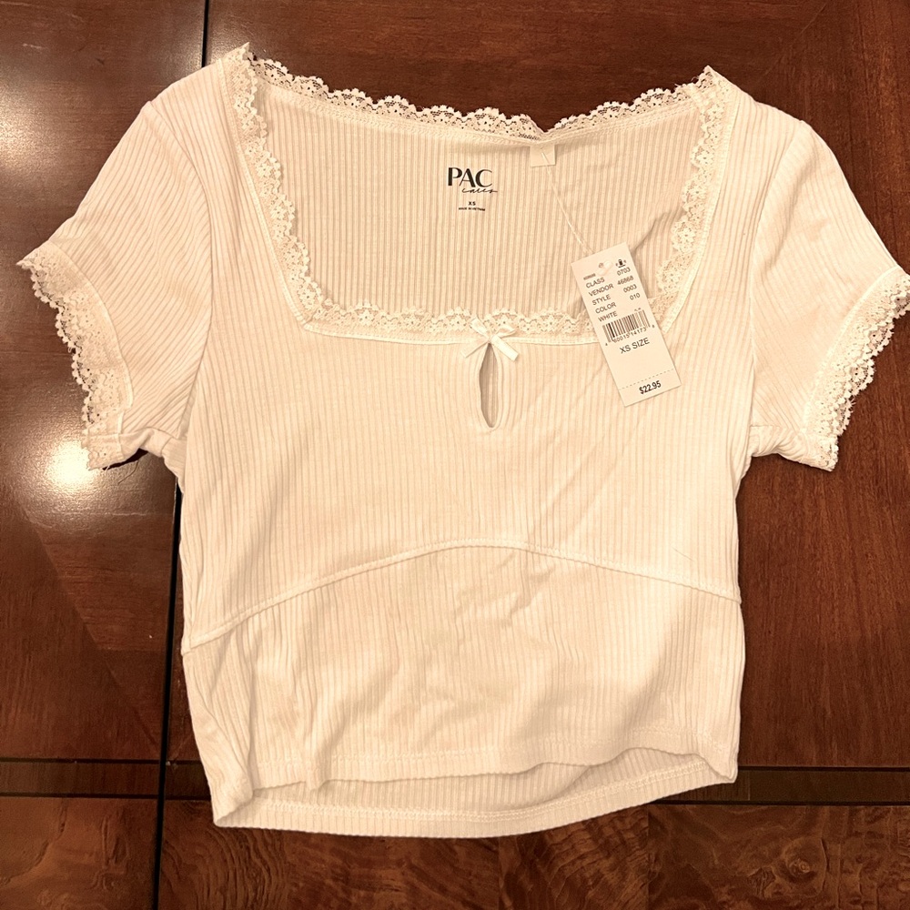 New with tags, ribbed white PacSun crop top with lace and keyhole with bow.
